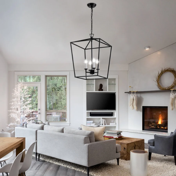 Matte black iron cage chandelier with candle-style lighting, ideal for dining rooms, foyers, and staircases