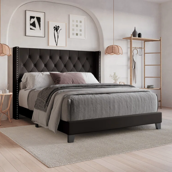 Mocha brown full size upholstered bed with tufted wingback headboard, nailhead trim, and faux leather finish on a solid wood frame.