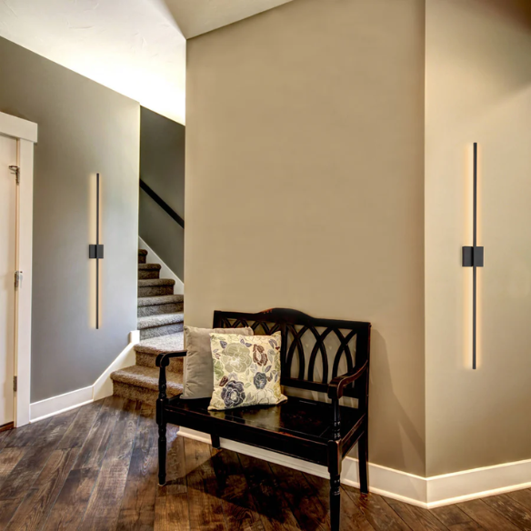 Modern black linear LED wall sconce with matte finish, designed for vertical or horizontal installation in contemporary interiors
