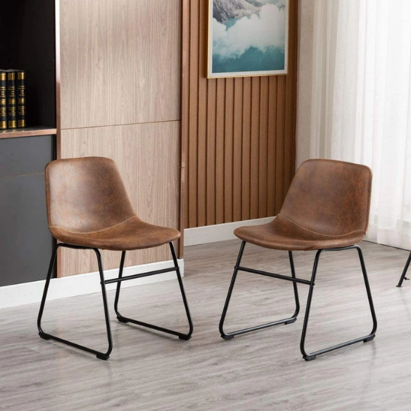 Set of two modern dining chairs upholstered in brown faux leather with curved backrests and black metal legs.