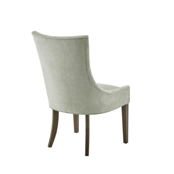 Set of 2 upholstered armless dining chairs in muted green with solid wood legs, high backrest, and elegant piping detail.