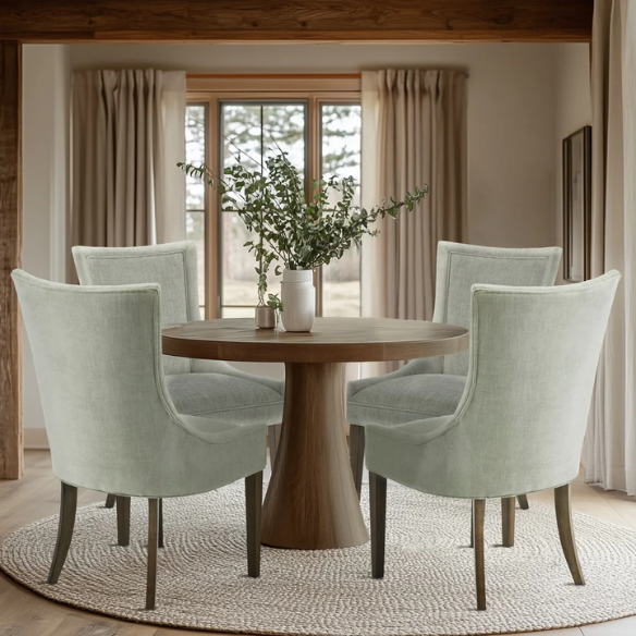 Set of 2 upholstered armless dining chairs in muted green with solid wood legs, high backrest, and elegant piping detail.