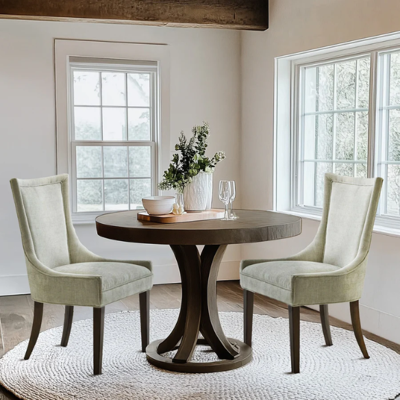 Set of 2 upholstered armless dining chairs in muted green with solid wood legs, high backrest, and elegant piping detail.