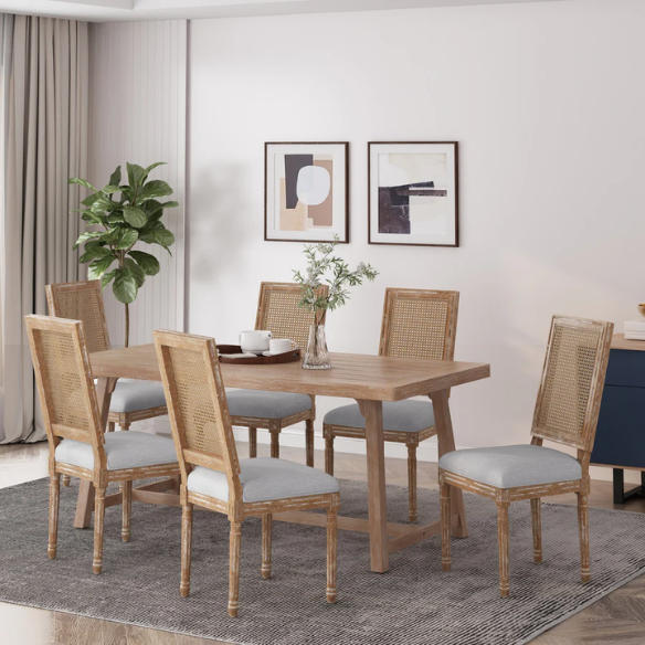 Set of 6 French country dining chairs with natural wood frames, handwoven cane backs, and light grey upholstered seats, featuring fluted legs and classic rustic charm.