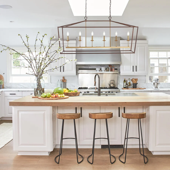 Oil rubbed bronze and brass gold lantern-style pendant light with exposed LED bulb and adjustable chain for kitchens, dining rooms, or entryways