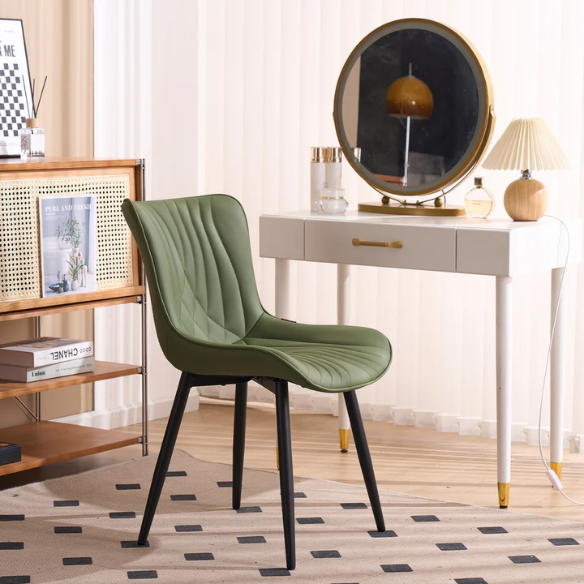 Set of 2 olive drab green faux leather dining chairs with fishtail backrest and metal legs, styled for a modern and mid-century inspired interior.