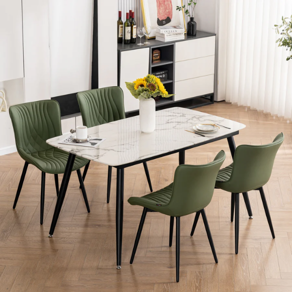 Set of 2 olive drab green faux leather dining chairs with fishtail backrest and metal legs, styled for a modern and mid-century inspired interior.