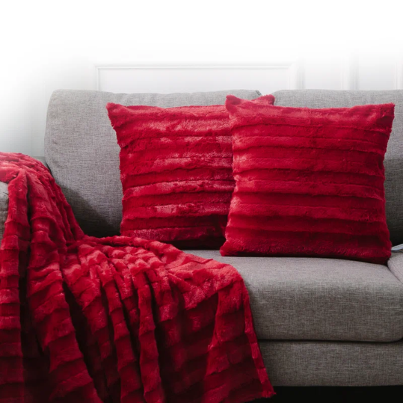 Set of two red faux fur throw pillows, 18x18 inches, square plush decorative cushions with microfiber fill—perfect for adding bold color and comfort to sofas, beds, and modern interiors