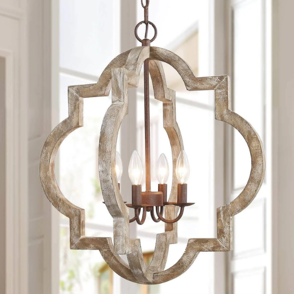 Rustic distressed wood and iron quatrefoil chandelier with candle-style lights and adjustable chain, ideal for farmhouse or French country interiors.