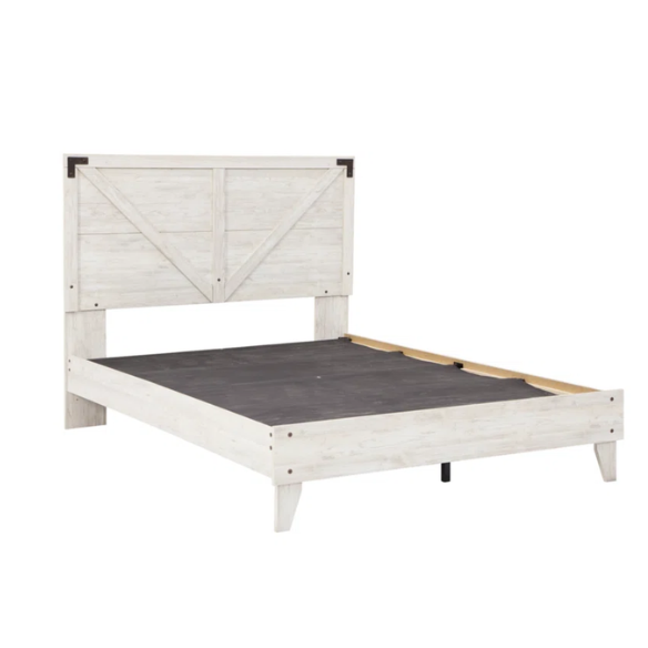 Rustic white platform bed with a distressed finish, crossbuck headboard, and metal support slats, styled in a cozy farmhouse bedroom.