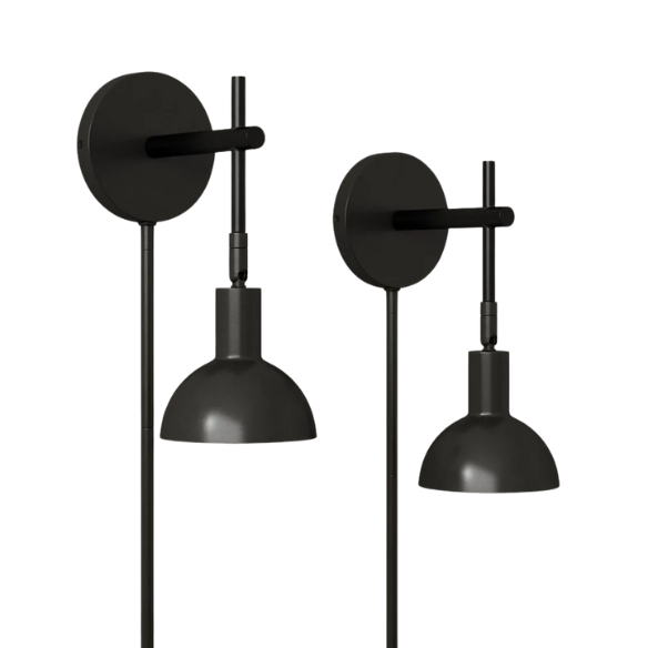 Set of 2 matte black plug-in wall sconces with adjustable swing arms and bell-shaped shades, ideal for bedside reading or task lighting in modern interiors.