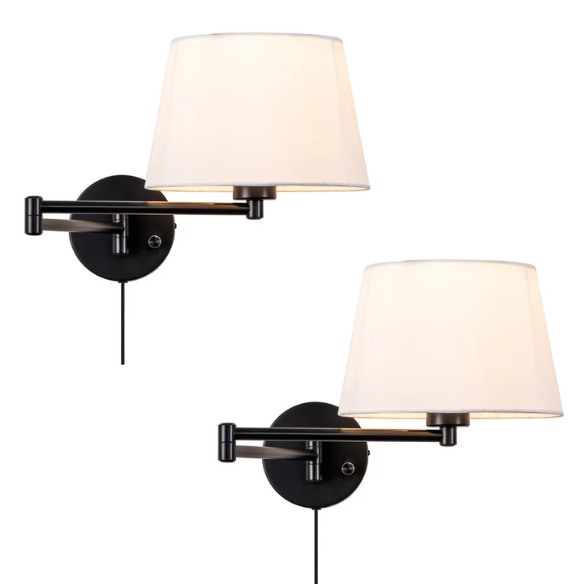 Set of 2 black swing arm wall sconces with white linen shades, adjustable arms, and plug-in or hardwired installation for bedroom or living room use