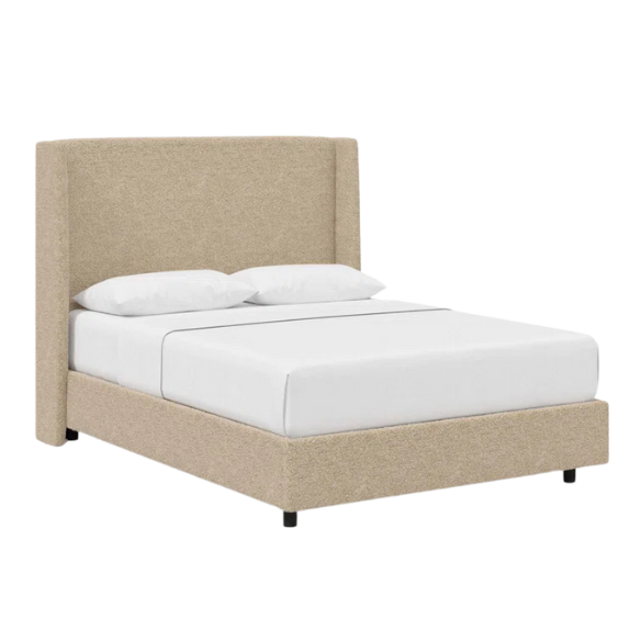 Tan king-size upholstered bed in bouclé fabric with wingback headboard and low-profile black metal legs.