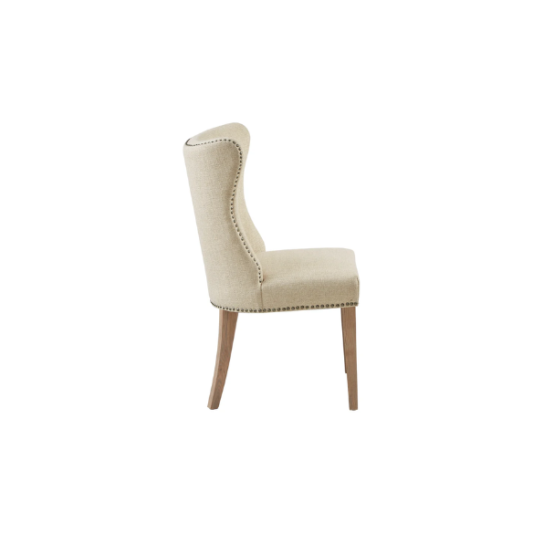 Set of two cream upholstered dining chairs with curved wingback design, dark pewter nailhead trim, and latte wood legs in a traditional style