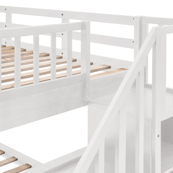 White twin over full bunk bed with stairs, built-in storage compartments, and three underbed drawers – solid wood frame ideal for children’s bedrooms