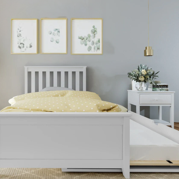 White solid wood twin bed with pull-out trundle, featuring modern slatted headboard and footboard – perfect for kids’ rooms, guests, and sleepovers.