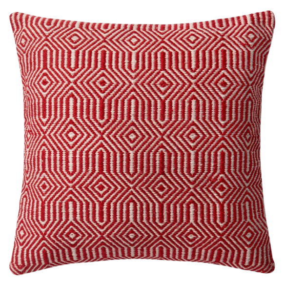 Red and cream geometric throw pillow on modern outdoor furniture with vibrant decor