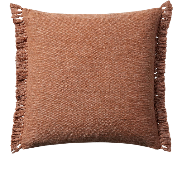 Rust cotton blend throw pillow with fringe, 22x22 square decorative cushion styled on a neutral-toned sofa for cozy, modern home décor.
