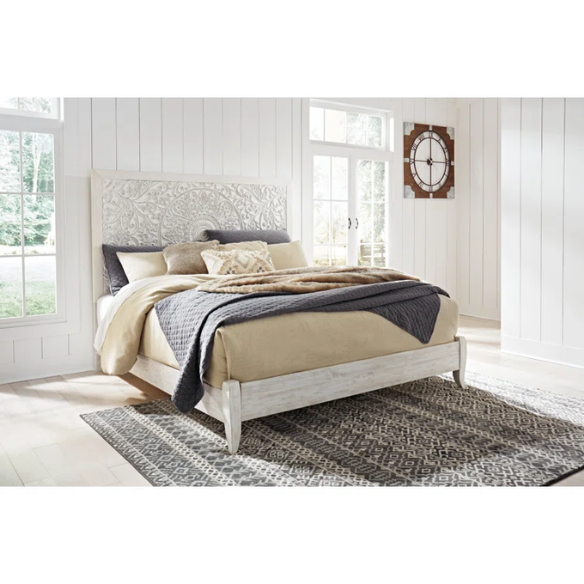 Rustic white king panel bed with intricately carved medallion headboard, decorative laminate finish, and adjustable height frame