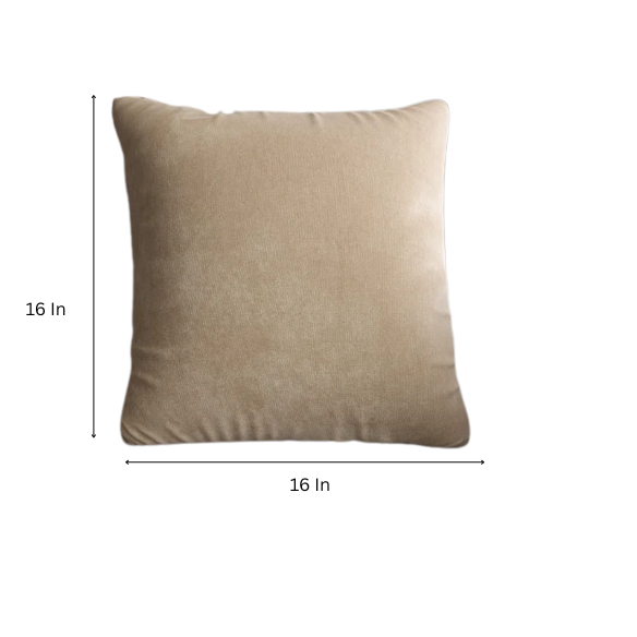 Sand crushed velvet throw pillow, 16x16 square with soft reversible fabric and hidden zipper, styled in a cozy, neutral-toned living space.