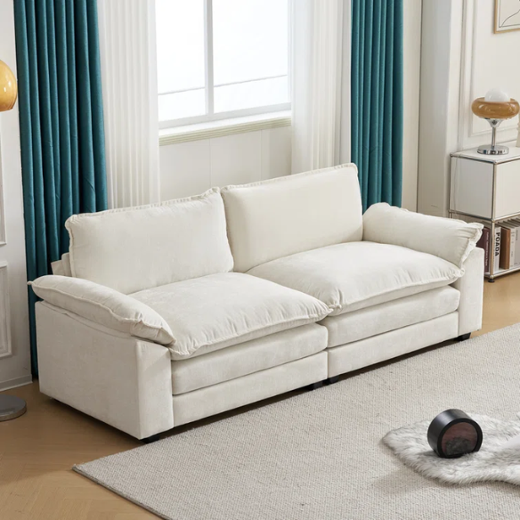 Soft warm cream chenille modular cloud sofa with pillow top arms, deep foam cushions, and matching ottoman