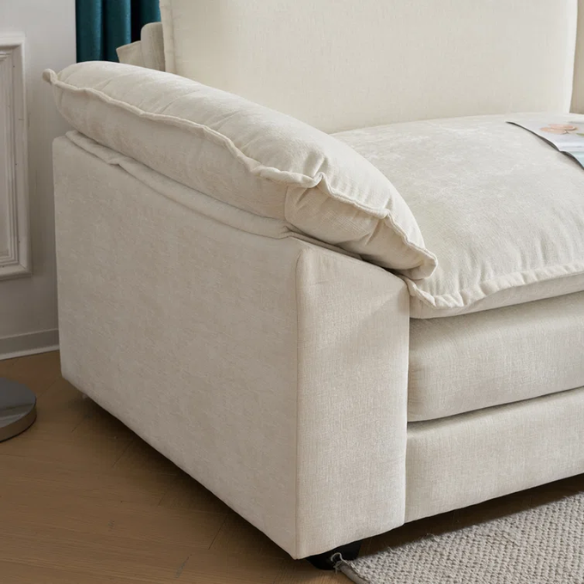 Soft warm cream chenille modular cloud sofa with pillow top arms, deep foam cushions, and matching ottoman