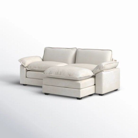 Soft warm cream chenille modular cloud sofa with pillow top arms, deep foam cushions, and matching ottoman