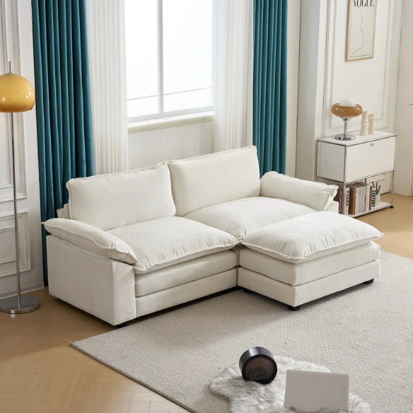 Soft warm cream chenille modular cloud sofa with pillow top arms, deep foam cushions, and matching ottoman
