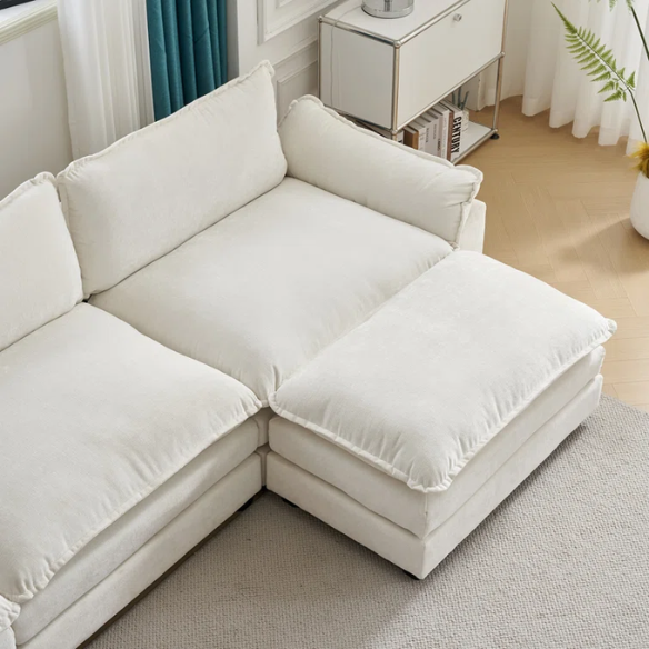 Soft warm cream chenille modular cloud sofa with pillow top arms, deep foam cushions, and matching ottoman