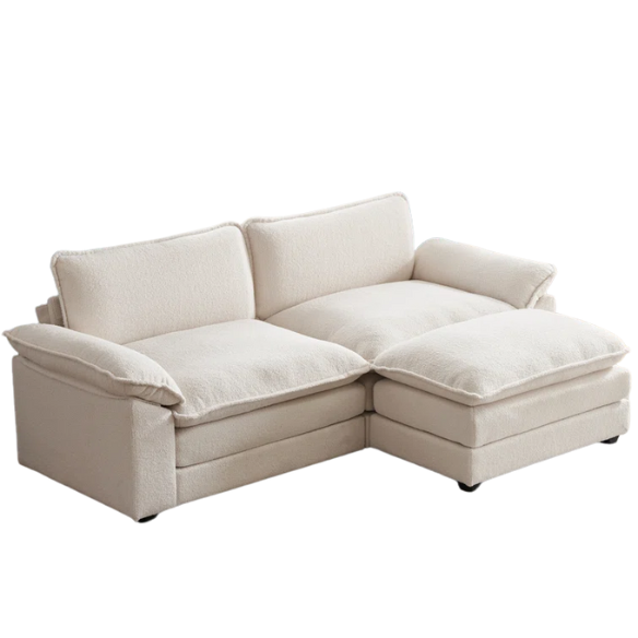 Soft warm cream modular cloud sofa with deep foam cushions, pillow top arms, and a matching free-standing ottoman
