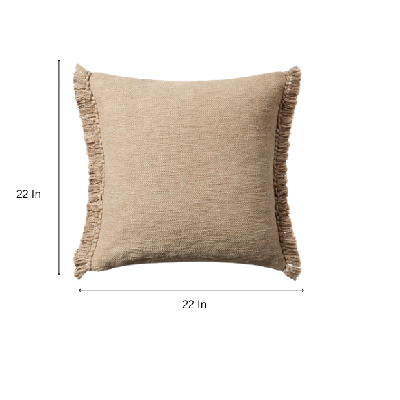Tan cotton blend throw pillow with fringe, 22x22 square cushion featuring soft texture and hidden zipper, styled on a neutral sofa for cozy, earthy decor.