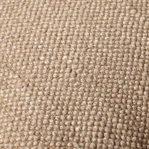 Tan cotton blend throw pillow with fringe, 22x22 square cushion featuring soft texture and hidden zipper, styled on a neutral sofa for cozy, earthy decor.