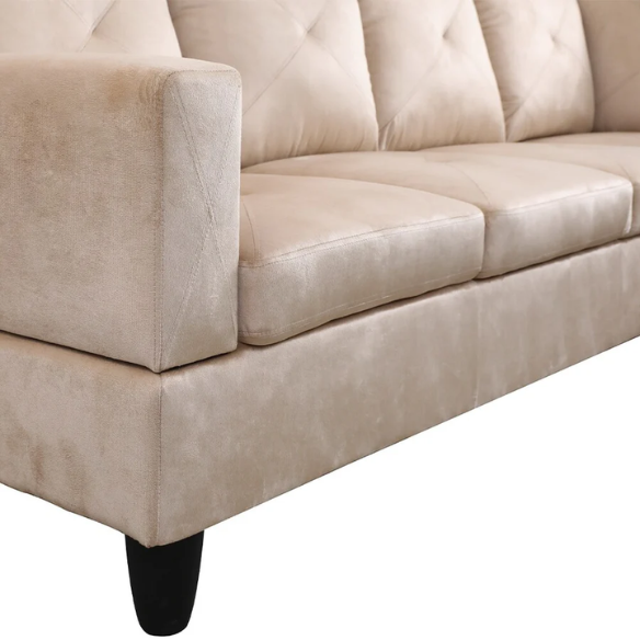 Tan L-shaped sectional sofa with right-facing chaise and ottoman, microfiber upholstery and light gray wooden legs