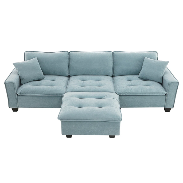 Tranquil sea blue suede L-shaped sectional sofa with tufted seat cushions, reversible chaise, removable ottoman, and two matching throw pillows