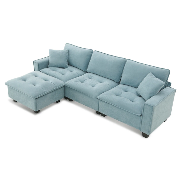 Tranquil sea blue suede L-shaped sectional sofa with tufted seat cushions, reversible chaise, removable ottoman, and two matching throw pillows