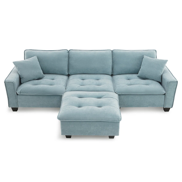 Tranquil sea blue suede L-shaped sectional sofa with tufted seat cushions, reversible chaise, removable ottoman, and two matching throw pillows