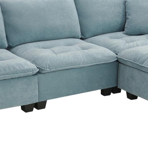 Tranquil sea blue suede L-shaped sectional sofa with tufted seat cushions, reversible chaise, removable ottoman, and two matching throw pillows