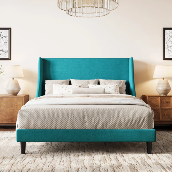 Turquoise linen upholstered queen platform bed with wingback headboard, tapered black legs, and slatted base – no box spring required