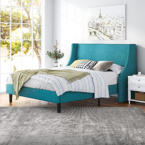 Turquoise linen upholstered queen platform bed with wingback headboard, tapered black legs, and slatted base – no box spring required