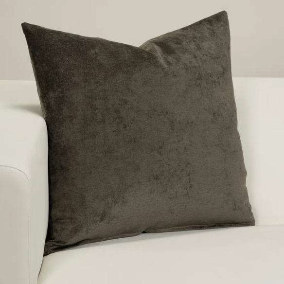 Umber crushed velvet throw pillow, 16x16 square with soft, reversible fabric and hidden zipper, styled on a cozy sofa for a warm, elegant touch.