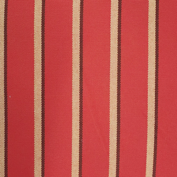 Weather-resistant striped accent pillow in red, tan, and black – durable, reversible, and mildew-resistant with overstuffed polyester fill, perfect for patio, deck, or living room décor.
