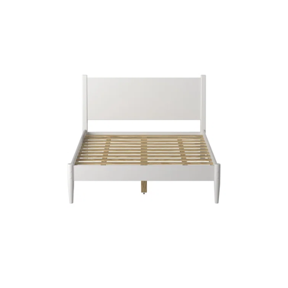 White full-size mid-century modern solid wood platform bed with tapered legs and rectangular headboard
