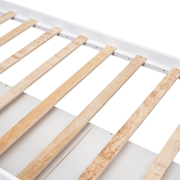 Solid white twin bed frame made from pine wood with underbed storage drawers and a non-toxic finish, designed for children or teens in a modern or rustic bedroom.
