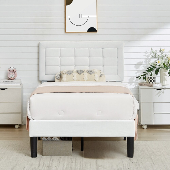 White twin-size upholstered platform bed with button-tufted adjustable headboard, wooden slats, steel center support, and underbed storage clearance.