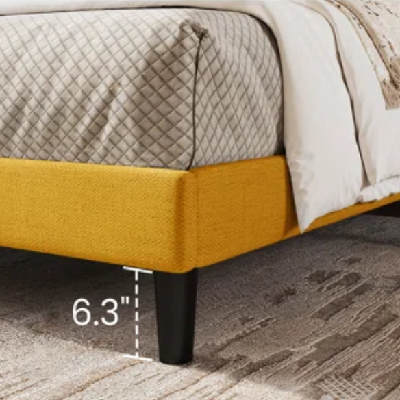 Yellow linen upholstered queen platform bed with wingback headboard, slatted base, and black tapered legs – no box spring required