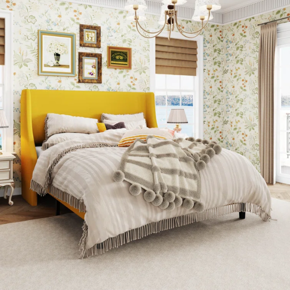 Yellow linen upholstered queen platform bed with wingback headboard, slatted base, and black tapered legs – no box spring required