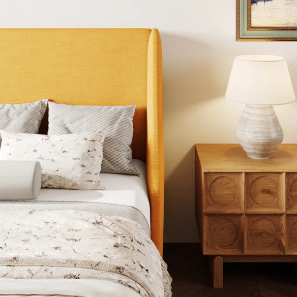 Yellow linen upholstered queen platform bed with wingback headboard, slatted base, and black tapered legs – no box spring required