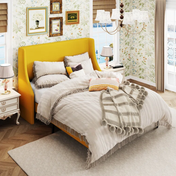 Yellow linen upholstered queen platform bed with wingback headboard, slatted base, and black tapered legs – no box spring required
