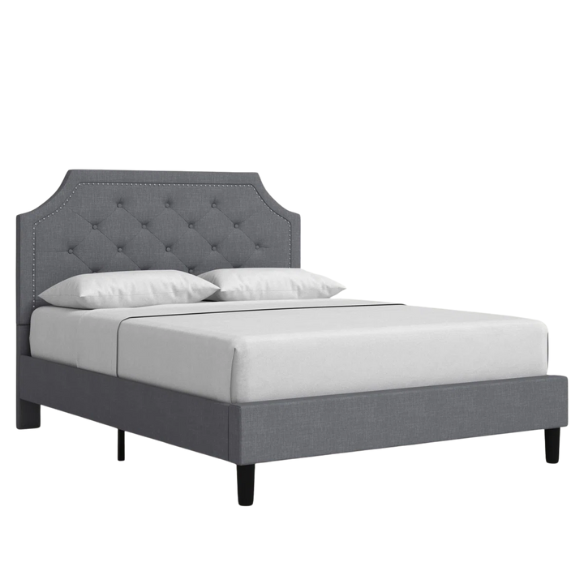 Gray upholstered bed with white bedding on a white background