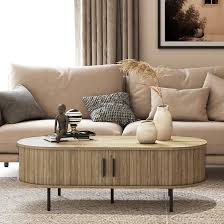 Mid-century modern coffee table with tambour sliding doors, featuring a warm oak grain finish and sleek, compact design. Ideal for storage and stylish living room decor.